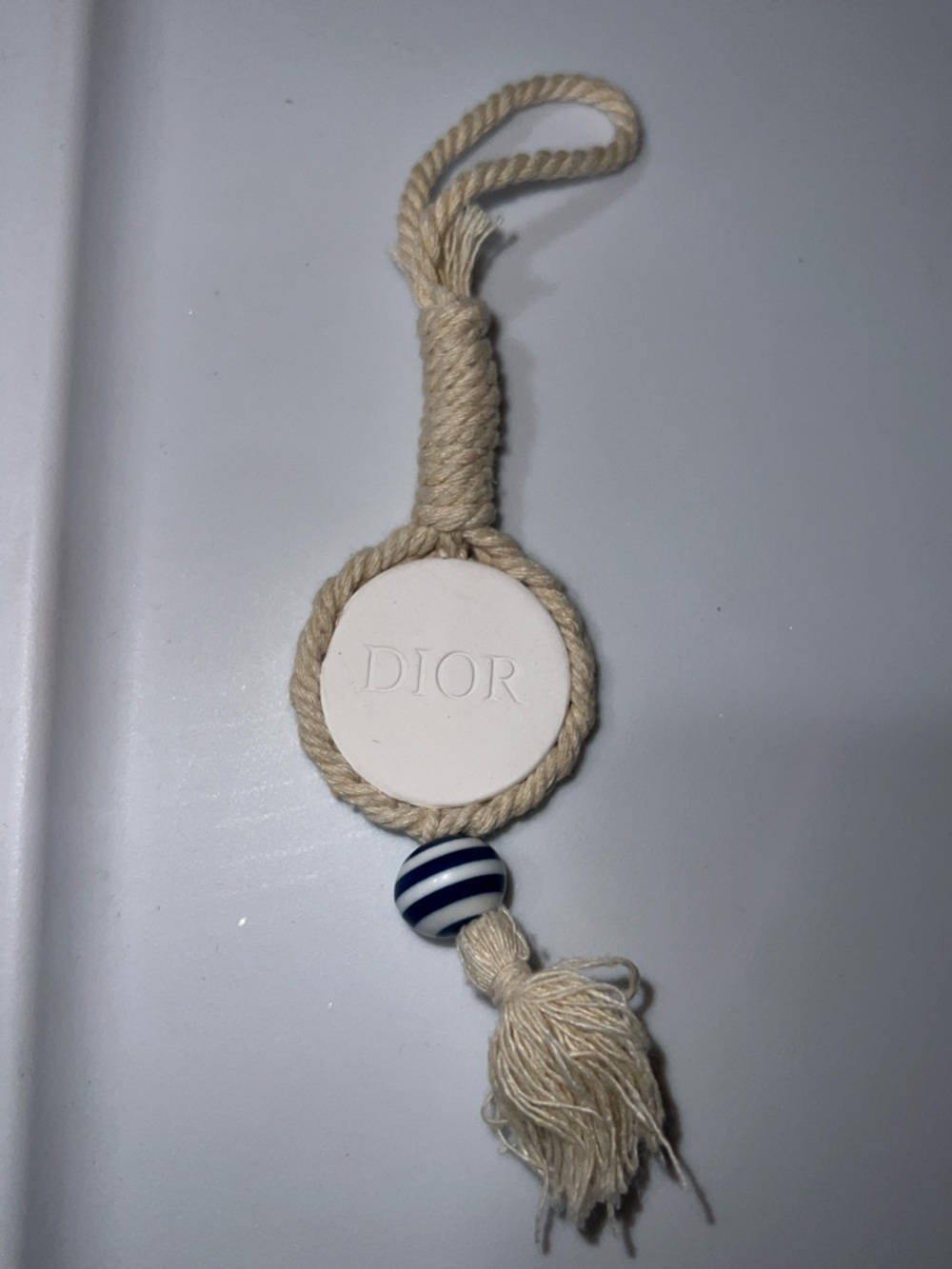Dior Parfums Cream perfume stone with Hanging Tassel Charm and Bead Detail